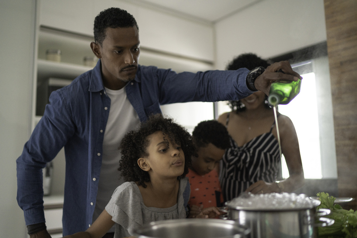 Family Cooking Together at Kitchen